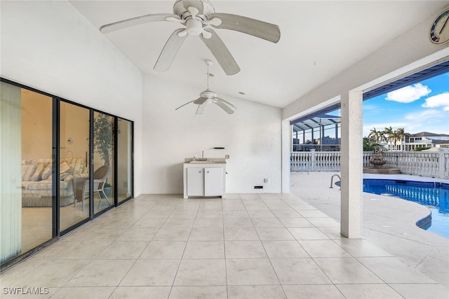 view of patio featuring a fenced in pool and sink