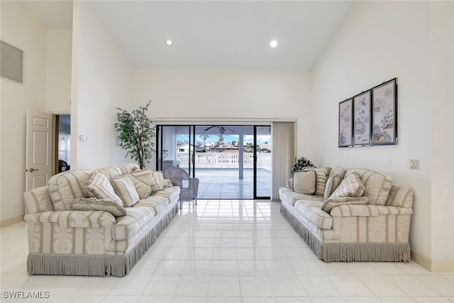 tiled living room with a high ceiling