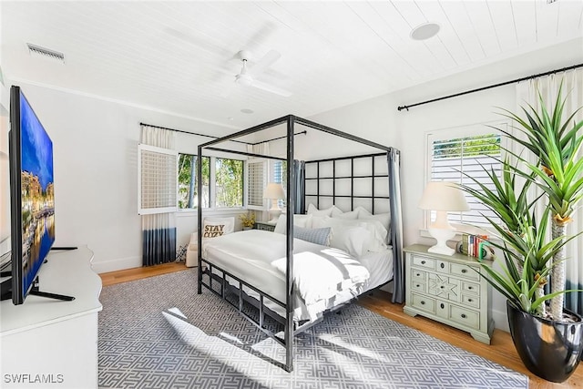 bedroom with wood-type flooring and ceiling fan