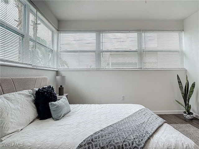 bedroom with hardwood / wood-style floors