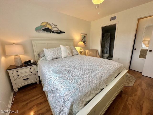 bedroom featuring dark hardwood / wood-style flooring