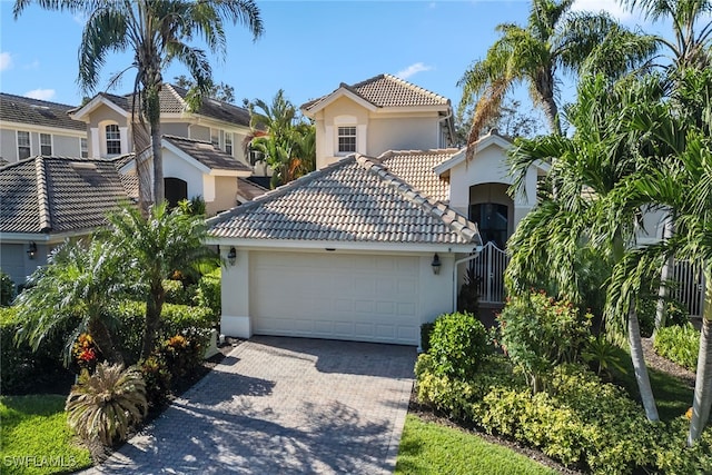 mediterranean / spanish-style house featuring a garage