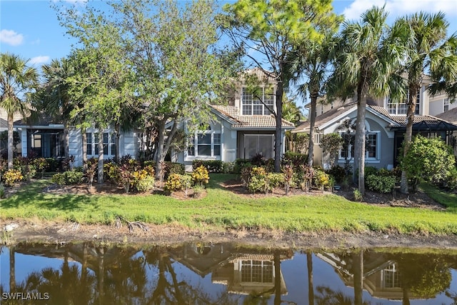 rear view of house with a water view