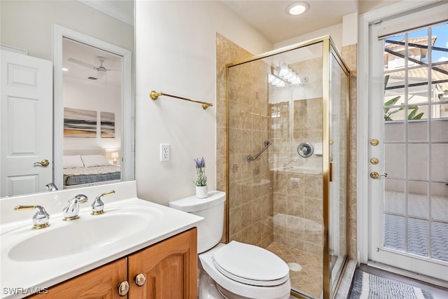 bathroom with toilet, vanity, and walk in shower