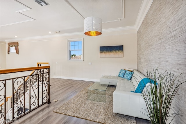 living room featuring ornamental molding and hardwood / wood-style flooring