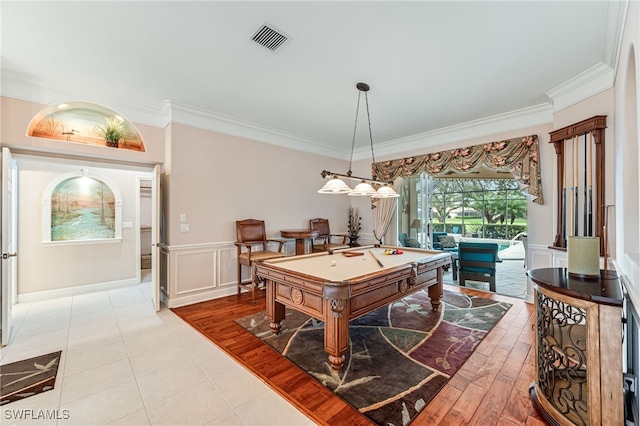 playroom with light wood-type flooring, ornamental molding, and pool table