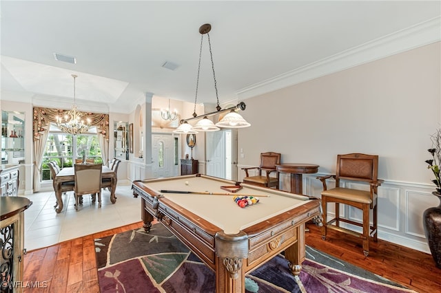 rec room featuring a chandelier, hardwood / wood-style flooring, ornamental molding, and billiards