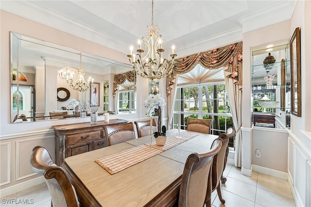 dining space with a notable chandelier, ornamental molding, and light tile patterned flooring