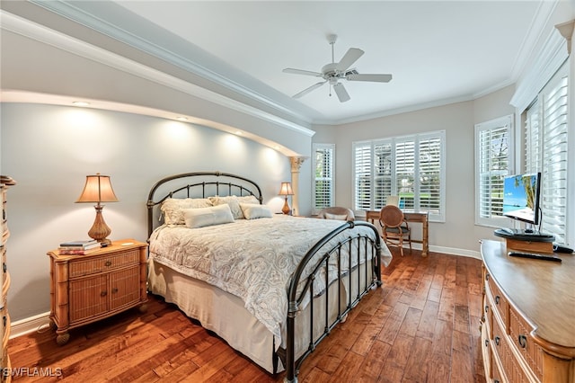 bedroom featuring ornamental molding, ceiling fan, and dark wood-type flooring