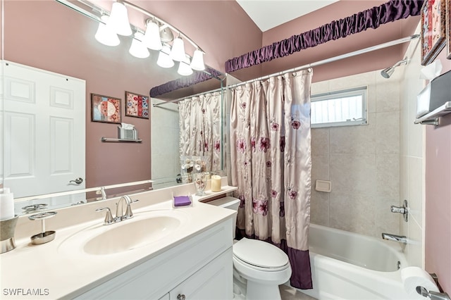 full bathroom featuring shower / bath combo, toilet, and vanity