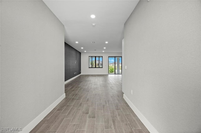 hallway with light wood-type flooring