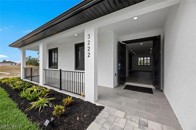 doorway to property with a porch