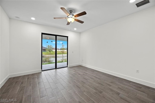 unfurnished room featuring dark hardwood / wood-style flooring and ceiling fan