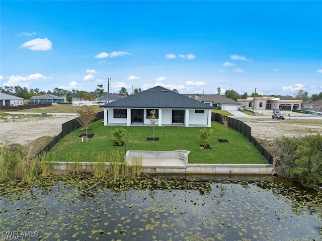 view of front of property featuring a water view and a front yard