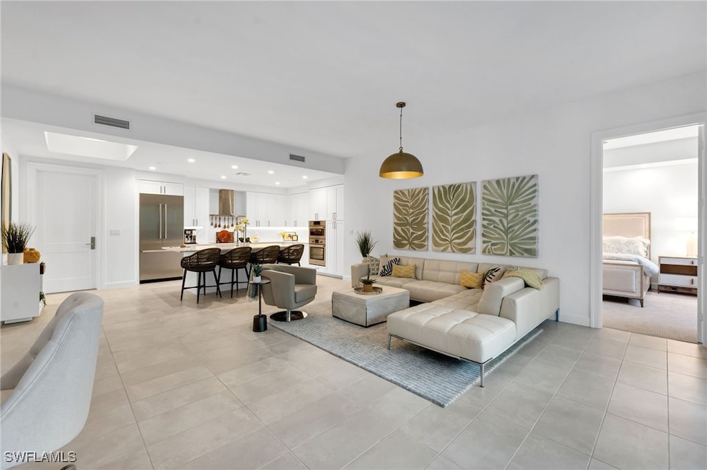 living room with light tile patterned floors