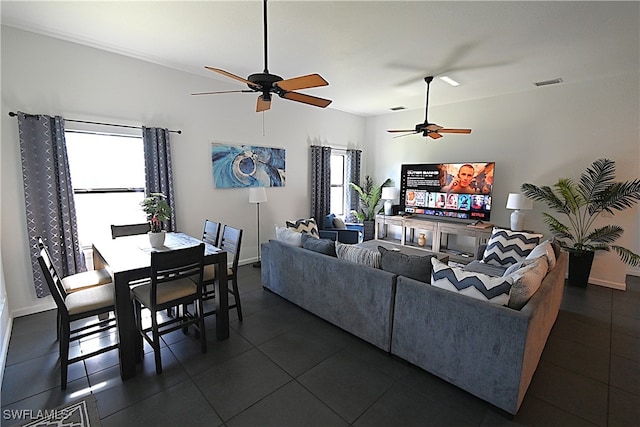 tiled living room featuring ceiling fan