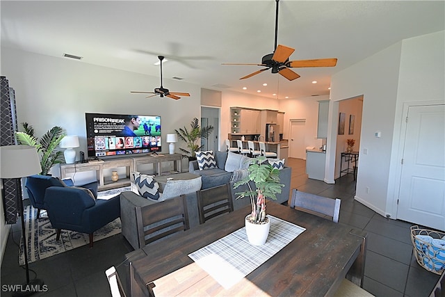 tiled living room with ceiling fan