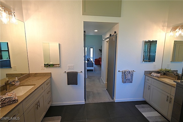 bathroom with tile patterned flooring and vanity