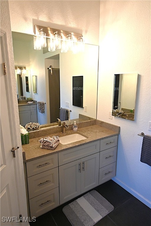 bathroom featuring tile patterned floors and vanity