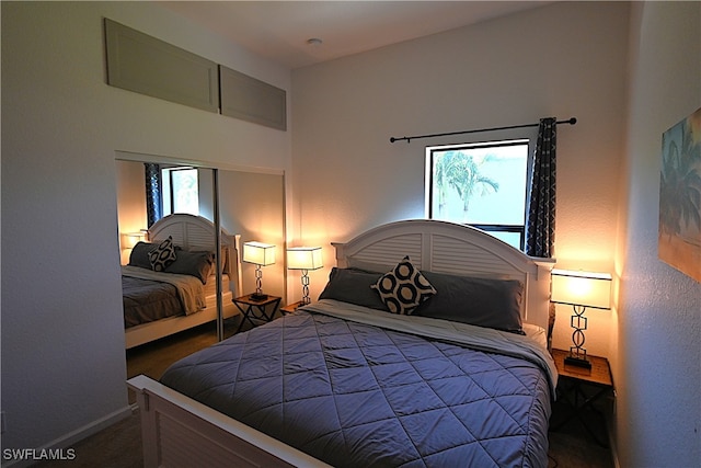 carpeted bedroom featuring multiple windows