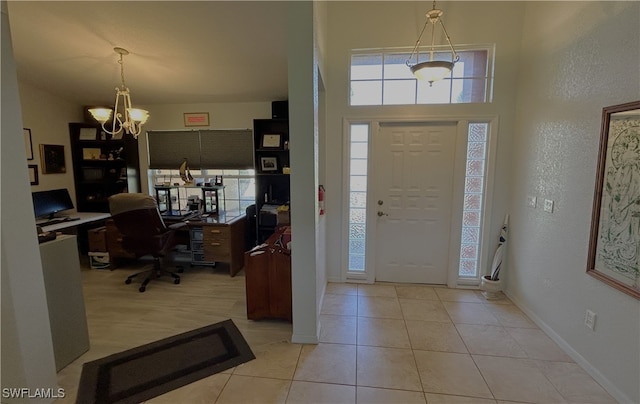 foyer featuring light tile patterned floors and a notable chandelier