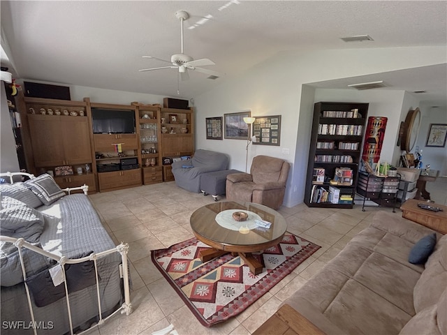 living room featuring tile patterned floors, ceiling fan, and lofted ceiling