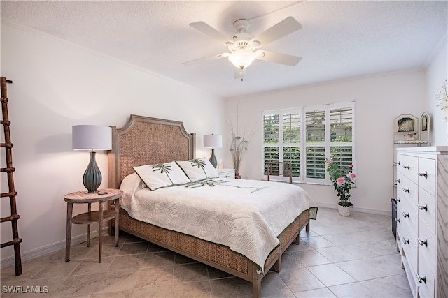 bedroom featuring ceiling fan, light tile patterned floors, a textured ceiling, and ornamental molding