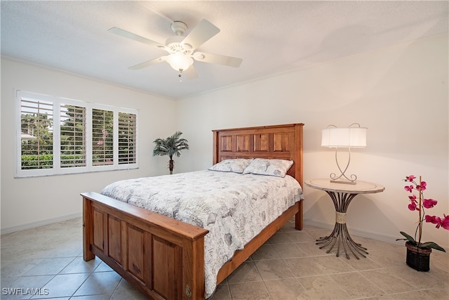 bedroom featuring ceiling fan and light tile patterned flooring