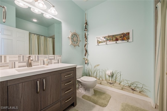 bathroom with tasteful backsplash, tile patterned flooring, vanity, and toilet