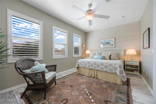 bedroom with wood-type flooring and ceiling fan