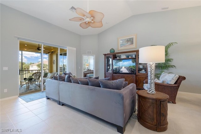 tiled living room featuring ceiling fan and vaulted ceiling