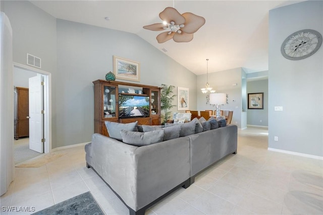 living room featuring light tile patterned flooring, ceiling fan with notable chandelier, and high vaulted ceiling