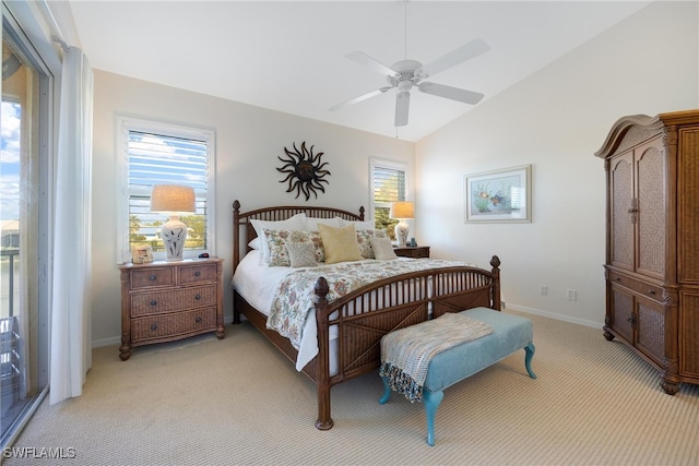 bedroom with light colored carpet, ceiling fan, and lofted ceiling