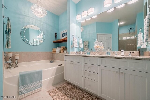 bathroom with vanity, separate shower and tub, and tile patterned floors