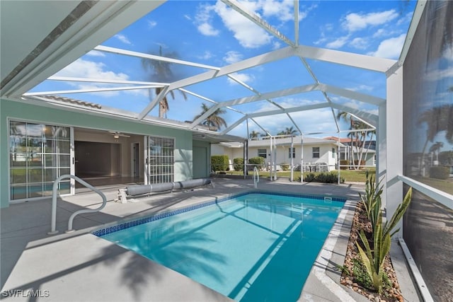146 SW 51st St, Cape Coral, FL 33914 - pool with glass enclosure, ceiling fan, and a patio