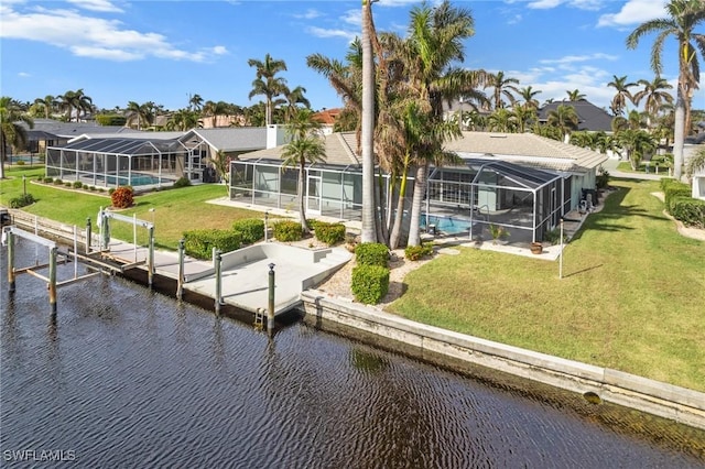 146 SW 51st St, Cape Coral, FL 33914 - view of dock with a water view, glass enclosure, boat lift, and a yard