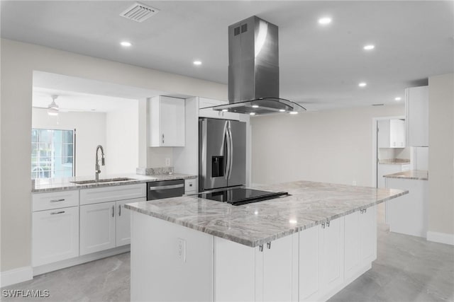 kitchen with ceiling fan, sink, island exhaust hood, appliances with stainless steel finishes, and white cabinets