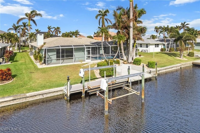 dock area featuring a lanai, a water view, and a lawn