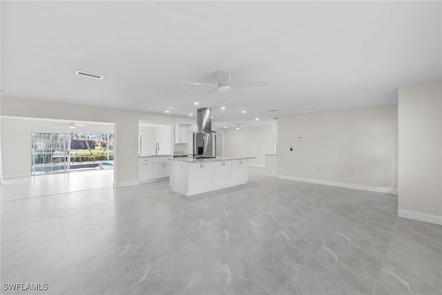 unfurnished living room featuring sink