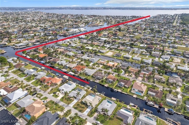 aerial view featuring a residential view and a water view