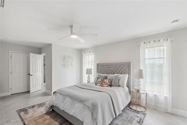 bedroom featuring multiple windows and baseboards