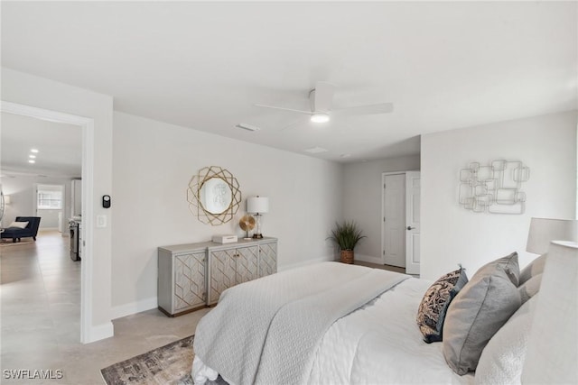 bedroom featuring ceiling fan and baseboards