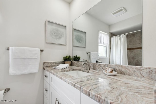 full bathroom with vanity and a shower with shower curtain