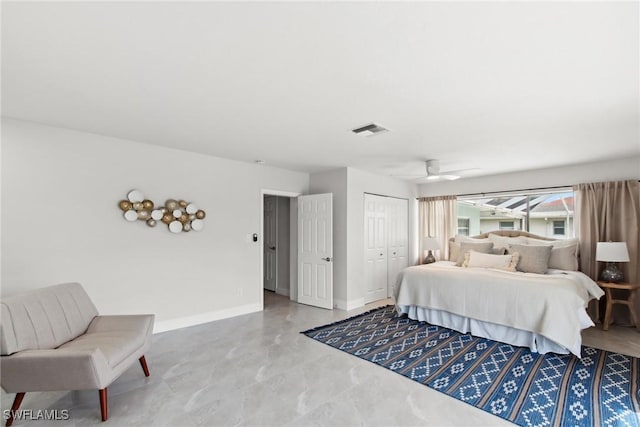 bedroom featuring a ceiling fan, a closet, visible vents, and baseboards