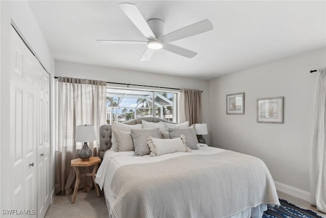 bedroom featuring a closet, a ceiling fan, and baseboards