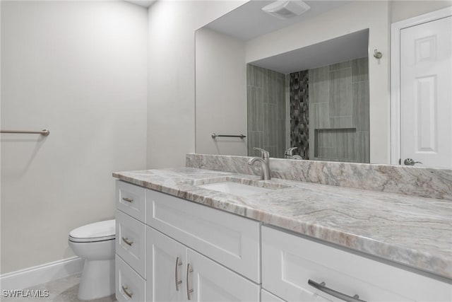 full bath featuring visible vents, baseboards, toilet, walk in shower, and vanity