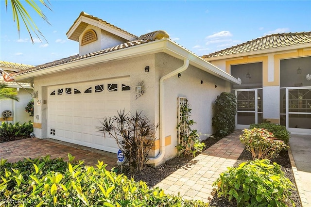 mediterranean / spanish house featuring a garage