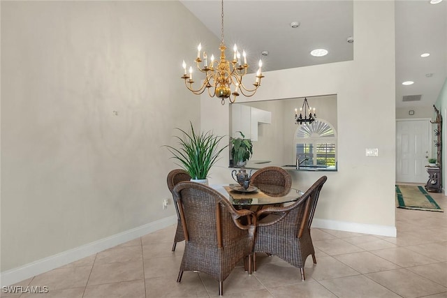 tiled dining space with an inviting chandelier