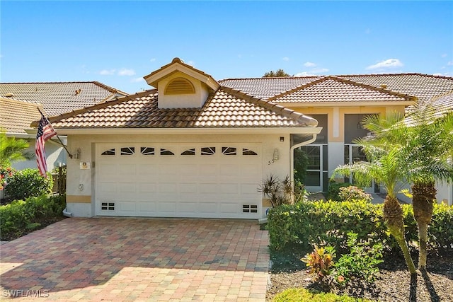 mediterranean / spanish house featuring a garage