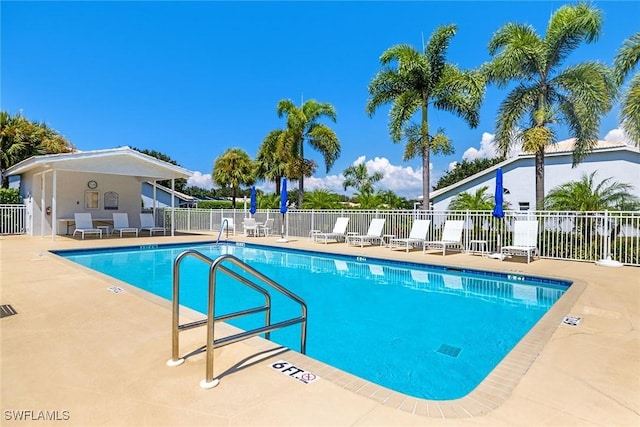 view of swimming pool with a patio area